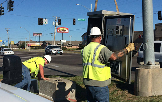 Mobility experts installing traffic cabinets